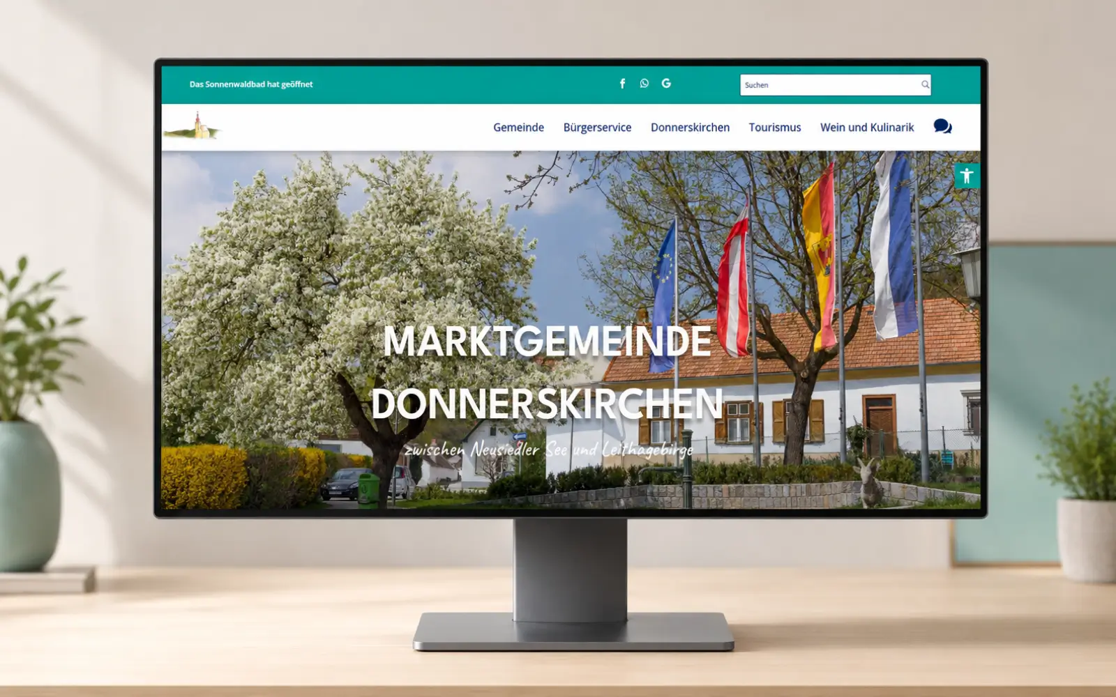Startseite der Marktgemeinde Donnerskirchen als Desktop-Mockup auf einem Monitor
